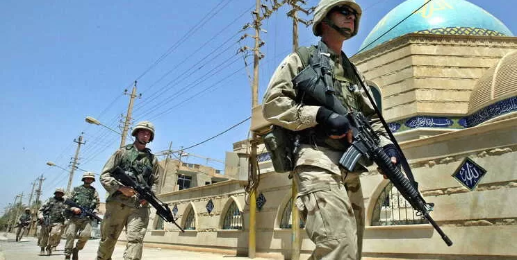 epa10526326 (FILE) - US soldiers patrol in downtown Baghdad, Iraq, 24 June 2003 (reissued 16 March 2023). A US-led coalition launched a military invasion of Iraq on 19 March 2003 following former President George W. Bush and his administration's claims that Iraq had stockpiled weapons of mass destruction. The invasion resulted in a change of political regime and years of political and social instability and crisis. The US withdrew its troops officially from Iraq in summer 2010.  EPA/VALDRIN XHEMAJ  ATTENTION: This Image is part of a PHOTO SET *** Local Caption *** 99253689