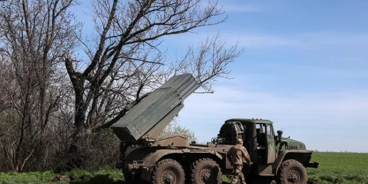 Ukrainian artillerymen prepare a BM-21 Grad multiple rocket launcher to fire towards Russian positions on the frontline, in Donetsk region on April 17, 2023. (Photo by Anatolii Stepanov / AFP)