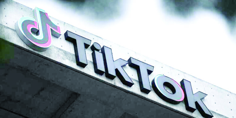 The TikTok logo is displayed outside TikTok social media app company offices in Culver City, California, on March 16, 2023. (Photo by Patrick T. Fallon / AFP)