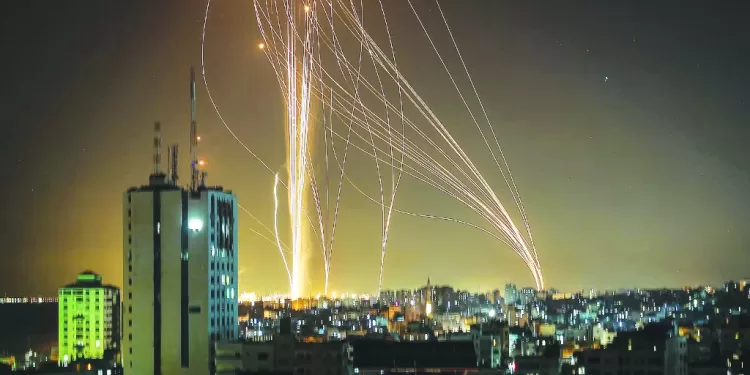 Rockets are launched from Gaza city, controlled by the Palestinian Hamas movement, in response to an Israeli air strike on a 12-storey building in the city, towards the coastal city of Tel Aviv, on May 11, 2021. (Photo by ANAS BABA / AFP)