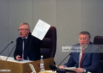Russian lower house, the State Duma, vice-chairman Oleg Morozov (L) speaks to lawmakers holding a copy of the new Strategic Arms Reduction Treaty (START)  before the first reading vote on the treaty in Duma, in Moscow , on December 24, 2010, with Liberal Democratic Party Leader, Duma vice-chairman, Vladimir Zhirinovsky (R) attending. Russia's lower house of parliament on Friday gave initial backing to a historic treaty with the US to slash the nuclear arsenals of the Cold War foes but warned final ratification would drag into next year. Although the ultra-nationalist Liberal Democratic Party and the Communists voted against the treaty, the dominance of pro-Kremlin ruling party United Russia means that the main doubt has been when, rather than if, parliament will ratify the accord. AFP PHOTO / DMITRY KOSTYUKOV (Photo by DMITRY KOSTYUKOV / AFP) (Photo by DMITRY KOSTYUKOV/AFP via Getty Images)