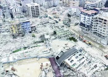epa10481769 An aerial view taken with a drone shows, a view of collapsed buildings after a powerful earthquake in Hatay, Turkey, 21 February 2023. More than 46,000 people have died and thousands more are injured after two major earthquakes struck southern Turkey and northern Syria on 06 February.  EPA/ERDEM SAHIN