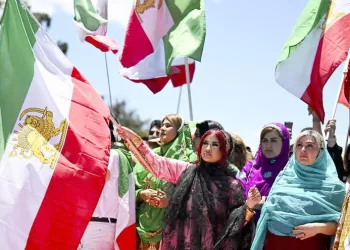 epa10333557 Demonstrators attend the Women Life Freedom protest in solidarity with citizens of Iran, outside Parliament House, in Canberra, Australia, 28 November 2022. After the death of Mahsa Amini, the Iranian people have taken to the streets to protest the government's treatment of the population, spurring protests in sympathy in cities around the world.  EPA/LUKAS COCH  AUSTRALIA AND NEW ZEALAND OUT