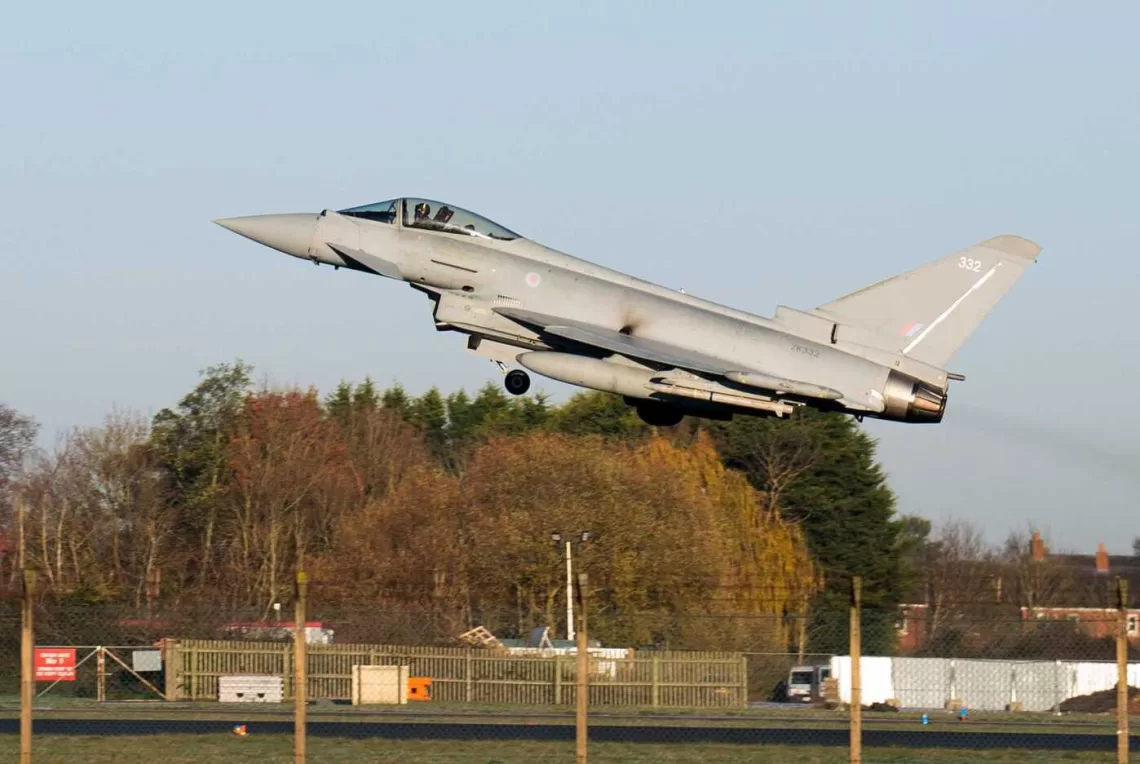 An RAF pilot takes off in a Typhoon fighter jet at Royal Air Force base RAF Coningsby, near Lincoln, eastern England, on December 9, 2022, during a visit by Britain's Prime Minister. - Japan, Britain and Italy said Friday they will jointly develop a next-generation fighter jet, in a project that holds scope for future cooperation with allies including the United States. The new jet project called Tempest, to be ready by 2035, is expected to merge the nations' current research into cutting-edge air combat technology, from stealth capacity to high-tech sensors. (Photo by Joe Giddens / POOL / AFP)