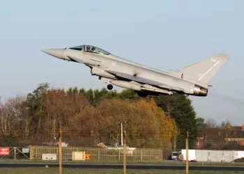 An RAF pilot takes off in a Typhoon fighter jet at Royal Air Force base RAF Coningsby, near Lincoln, eastern England, on December 9, 2022, during a visit by Britain's Prime Minister. - Japan, Britain and Italy said Friday they will jointly develop a next-generation fighter jet, in a project that holds scope for future cooperation with allies including the United States. The new jet project called Tempest, to be ready by 2035, is expected to merge the nations' current research into cutting-edge air combat technology, from stealth capacity to high-tech sensors. (Photo by Joe Giddens / POOL / AFP)