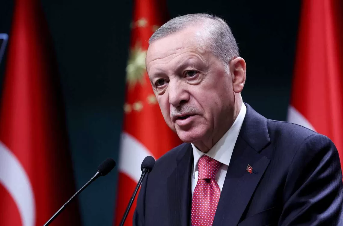 Turkish President Recep Tayyip Erdogan addresses the floor after signing the decree announcing that national general elections will he held on May 14, at the Presidential Complex or Kulliye in Ankara on March 10, 2023. (Photo by Adem ALTAN / AFP)