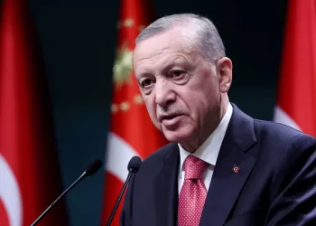 Turkish President Recep Tayyip Erdogan addresses the floor after signing the decree announcing that national general elections will he held on May 14, at the Presidential Complex or Kulliye in Ankara on March 10, 2023. (Photo by Adem ALTAN / AFP)