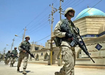 epa10526326 (FILE) - US soldiers patrol in downtown Baghdad, Iraq, 24 June 2003 (reissued 16 March 2023). A US-led coalition launched a military invasion of Iraq on 19 March 2003 following former President George W. Bush and his administration's claims that Iraq had stockpiled weapons of mass destruction. The invasion resulted in a change of political regime and years of political and social instability and crisis. The US withdrew its troops officially from Iraq in summer 2010.  EPA/VALDRIN XHEMAJ  ATTENTION: This Image is part of a PHOTO SET *** Local Caption *** 99253689