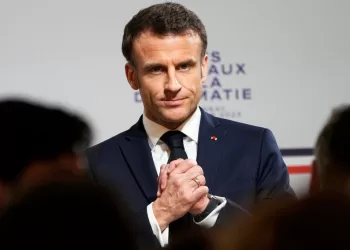 TOPSHOT - French President Emmanuel Macron reacts during the National Roundtable on Diplomacy at the Foreign Ministry in Paris on March 16, 2023. - Frances Foreign Ministry is undertaking a sweeping review of its vast diplomatic corps, an effort driven by President Emmanuel Macron to adapt French diplomacy to 21st century challenges. (Photo by Michel Euler / POOL / AFP) (Photo by MICHEL EULER/POOL/AFP via Getty Images)