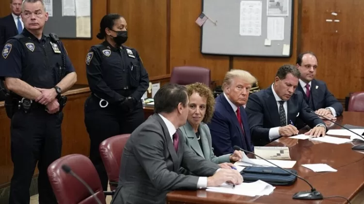 NEW YORK, NEW YORK - APRIL 04: Former U.S. President Donald Trump sits at the defense table with his defense team in a Manhattan court during his arraignment on April 4, 2023, in New York City. Trump was arraigned during his first court appearance today following an indictment by a grand jury that heard evidence about money paid to adult film star Stormy Daniels before the 2016 presidential election. With the indictment, Trump becomes the first former U.S. president in history to be charged with a criminal offense. Seth Wenig-Pool/Getty Images/AFP (Photo by POOL / GETTY IMAGES NORTH AMERICA / Getty Images via AFP)