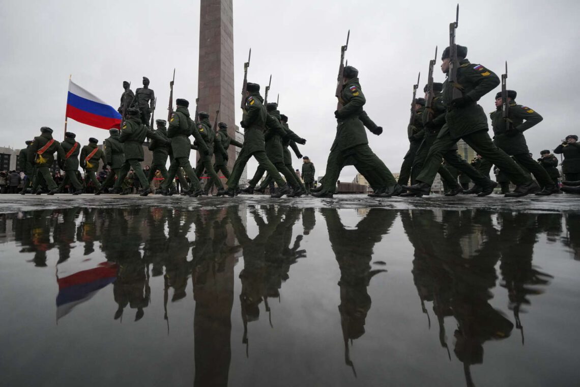 Russian army soldiers attend an event marking the 80th anniversary of the break of Nazi's siege of Leningrad, (now St. Petersburg) during World War II at the monument of the Heroic Defenders of Leningrad, in St. Petersburg, Russia, Wednesday, Jan. 18, 2023. The Red Army broke the nearly 900-day blockade of the city on January 18, 1943 after fierce fighting. (AP Photo/Dmitri Lovetsky)