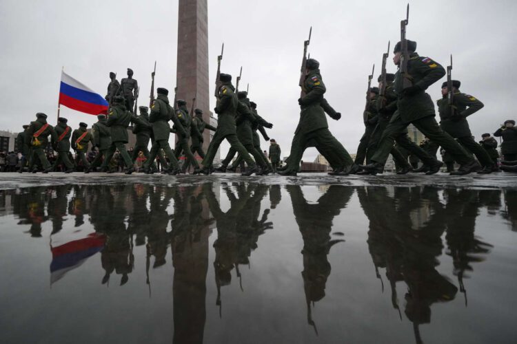 Russian army soldiers attend an event marking the 80th anniversary of the break of Nazi's siege of Leningrad, (now St. Petersburg) during World War II at the monument of the Heroic Defenders of Leningrad, in St. Petersburg, Russia, Wednesday, Jan. 18, 2023. The Red Army broke the nearly 900-day blockade of the city on January 18, 1943 after fierce fighting. (AP Photo/Dmitri Lovetsky)