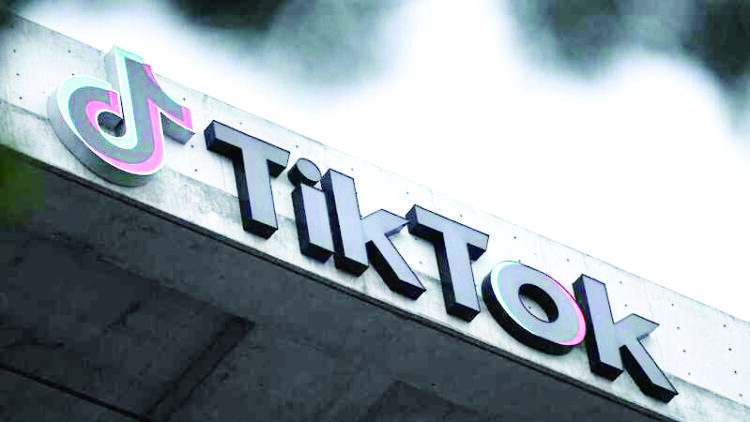The TikTok logo is displayed outside TikTok social media app company offices in Culver City, California, on March 16, 2023. (Photo by Patrick T. Fallon / AFP)