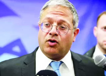 epa10531446 Israeli Minister of National Security Itamar Ben-Gvir talks to reporters ahead of a weekly cabinet meeting in the prime minister's office in Jerusalem, 19 March 2023.  EPA/ABIR SULTAN / POOL
