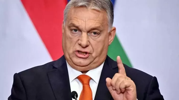 Hungarian Prime Minister Viktor Orban gestures as he addresses an annual press conference in Budapest on December 21, 2022, prior to the government's last meeting of the year 2022. (Photo by Attila KISBENEDEK / AFP)