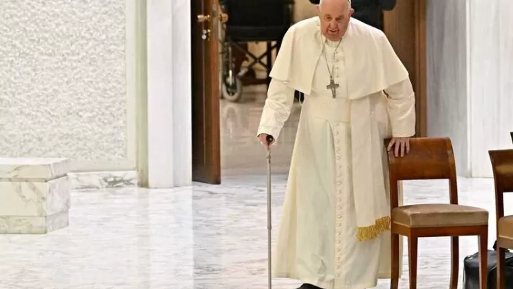 Pope Francis arrives for the weekly general audience in Paul-VI hall at the Vatican on December 13, 2023. (Photo by Andreas SOLARO / AFP)