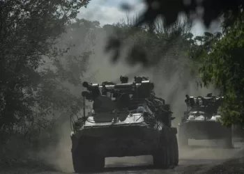 Ukrainian servicemen ride on armoured personnel carriers (APC) on a road toward Bakhmut, Donetsk region, on July 1, 2023, amid the Russian invasion of Ukraine. (Photo by Genya SAVILOV / AFP)