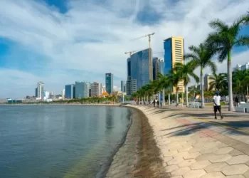 Luanda, Angola – December 15, 2019: People walking on a sunny day at Bay of Luanda. Editorial illustrative.
