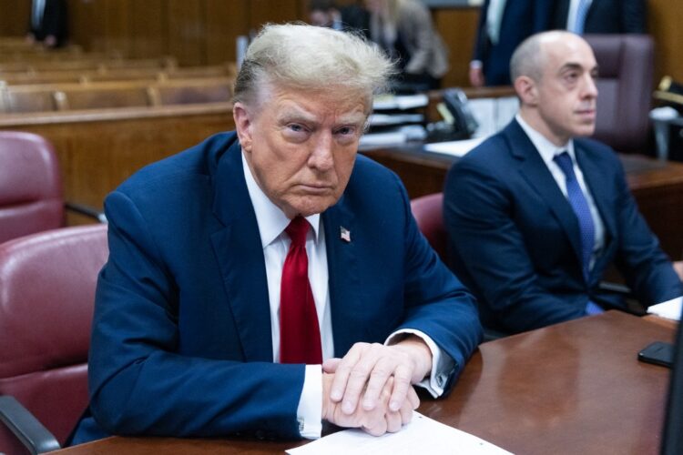 Former US President Donald Trump attends the first day of his trial for allegedly covering up hush money payments linked to extramarital affairs, at Manhattan Criminal Court in New York City on April 15, 2024. Donald Trump is in court Monday as the first US ex-president ever to be criminally prosecuted, a seismic moment for the United States as the presumptive Republican nominee campaigns to re-take the White House. The scandal-plagued 77-year-old is accused of falsifying business records in a scheme to cover up an alleged sexual encounter with adult film actress Stormy Daniels to shield his 2016 election campaign from adverse publicity. (Photo by JEENAH MOON / POOL / AFP)